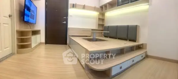 Modern living room with built-in seating and wooden flooring