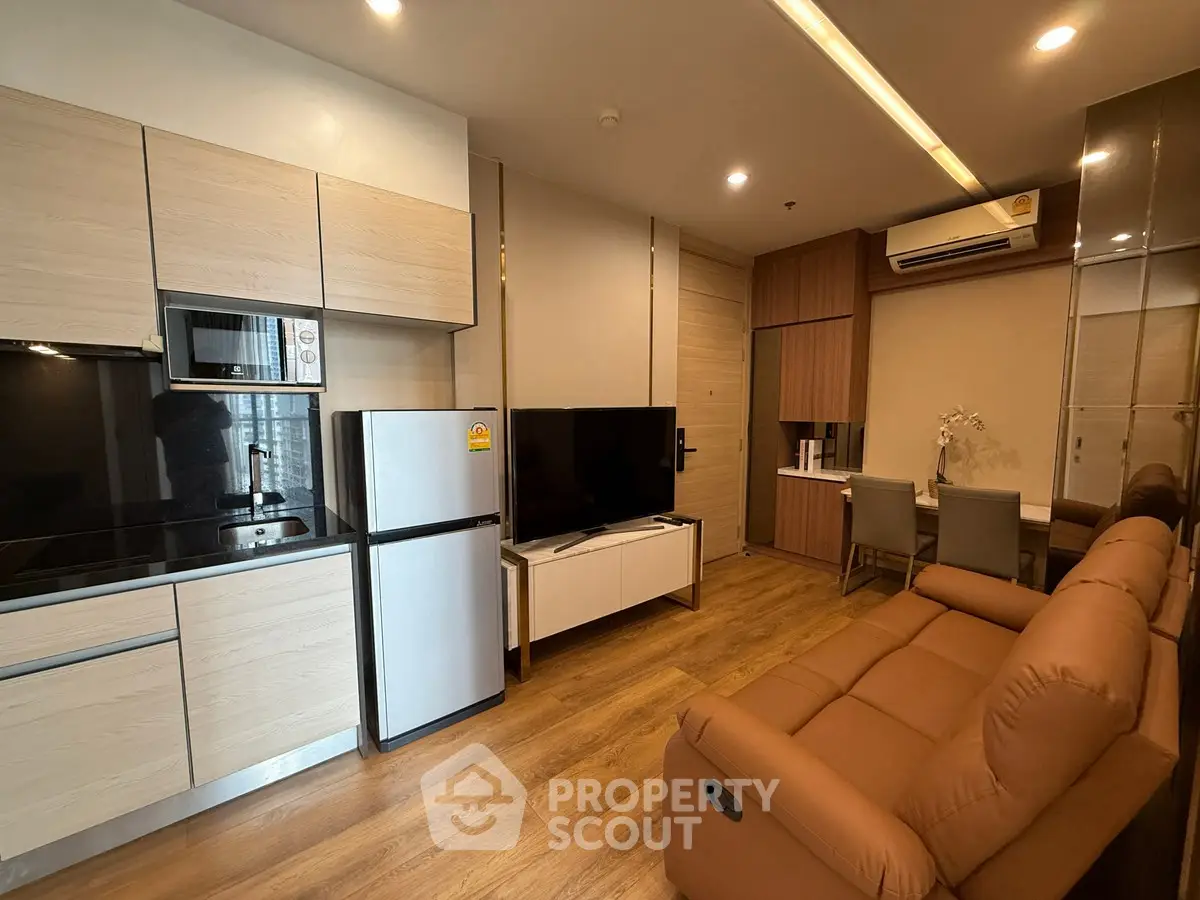 Modern apartment living room with open kitchen and stylish furniture