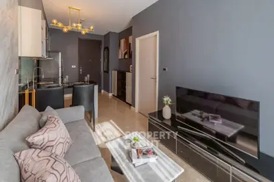 Modern living room with sleek design, featuring a cozy sofa, stylish TV unit, and elegant dining area.