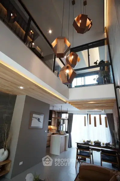 Stunning modern living room with high ceiling and unique wooden lighting fixtures