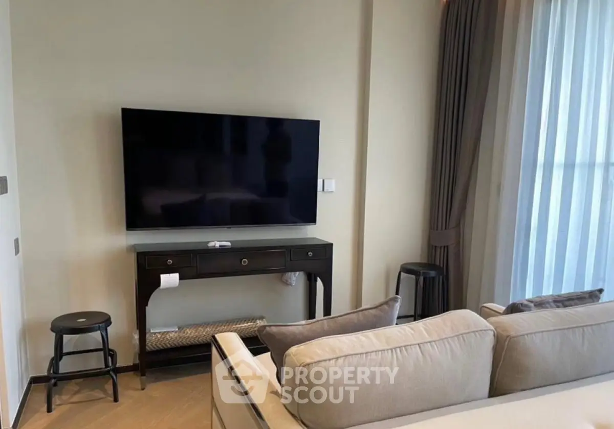 Modern living room with sleek TV setup and elegant furniture