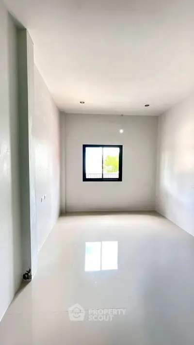 Spacious empty room with large window and glossy white floor, perfect for customization.