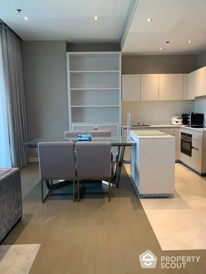 Modern open-layout kitchen with dining area and sleek cabinetry