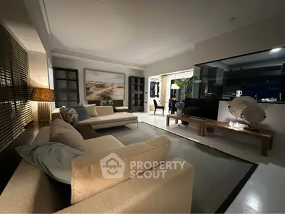 Luxurious modern living room with elegant decor and open layout, perfect for relaxation and entertainment.