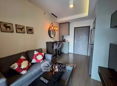 Modern living room with stylish decor and cozy seating in a contemporary apartment.