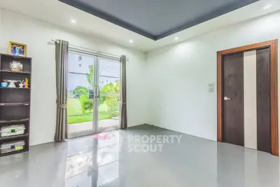 Spacious room with garden view and modern sliding doors
