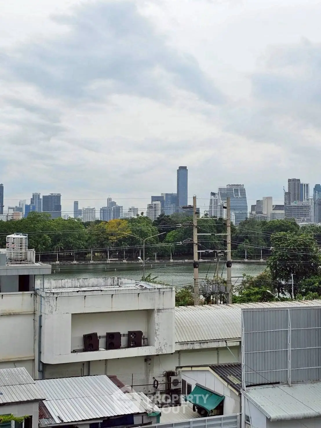 Stunning cityscape view from a high-rise building overlooking a river and skyline.