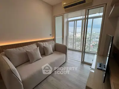 Modern living room with city view and cozy sofa in high-rise apartment