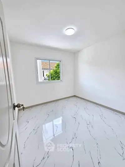 Bright empty room with glossy marble floor and window view