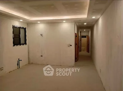 Spacious unfinished room with recessed lighting and potential for customization.