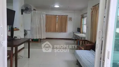 Spacious living room with modern decor and ample natural light