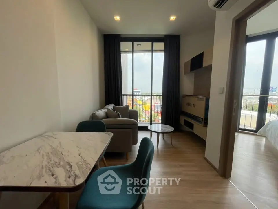 Modern living room with balcony view and stylish furniture