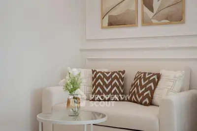 Elegant living room with stylish decor and cozy seating area.