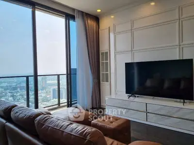Luxurious high-rise living room with stunning city view and modern decor.