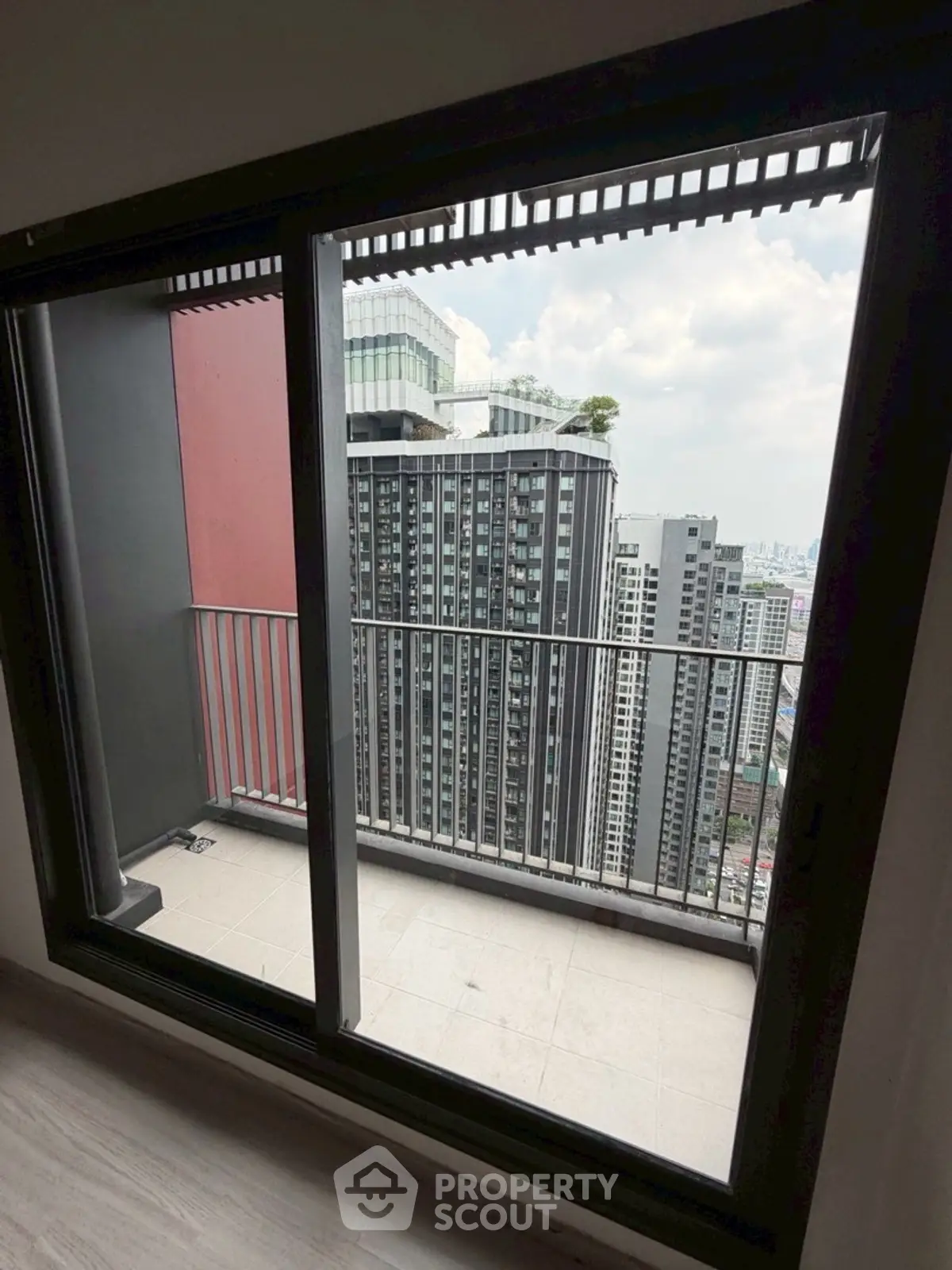 Stunning cityscape view from a modern high-rise balcony, perfect for urban living enthusiasts.