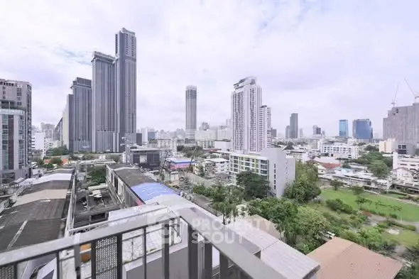 Stunning cityscape view from a high-rise balcony showcasing modern skyscrapers and urban landscape.
