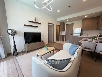 Modern living room with stylish decor and open kitchen layout