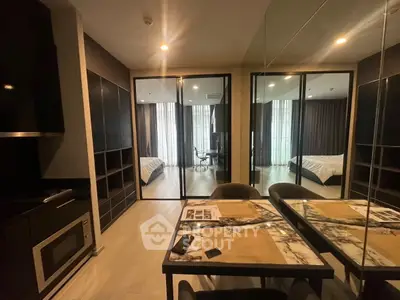 Modern apartment interior with sleek kitchen and cozy bedroom view