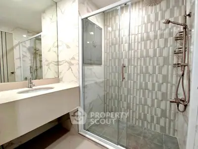 Modern bathroom with glass shower and elegant marble finishes