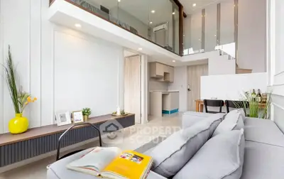 Modern loft apartment with open layout and stylish decor, featuring a cozy living area and mezzanine.