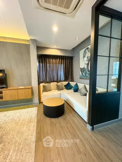 Stylish modern living room with cozy sectional sofa and elegant decor