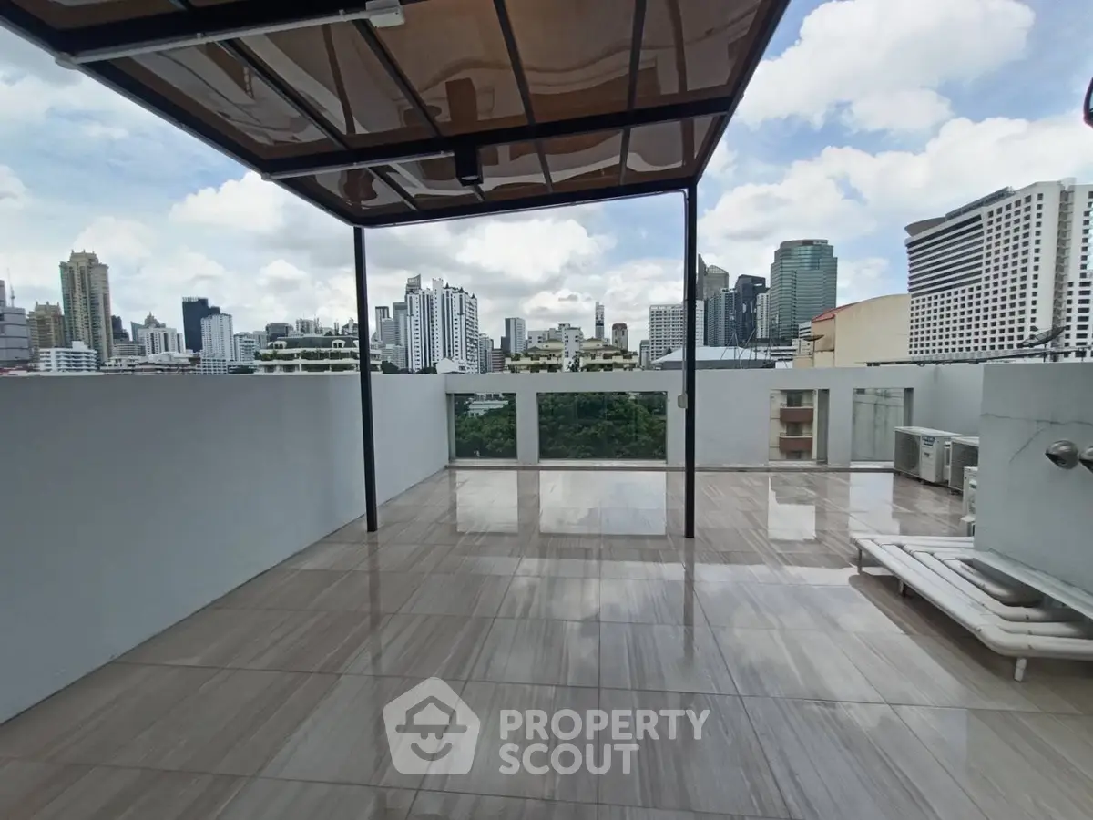 Stunning rooftop terrace with panoramic city skyline views, perfect for urban living.