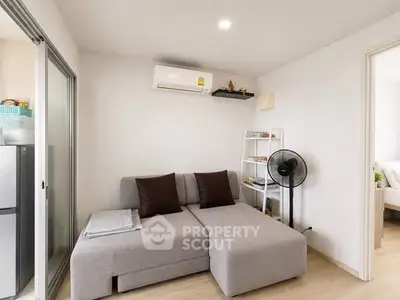 Modern living room with sleek sofa and air conditioning in a cozy apartment