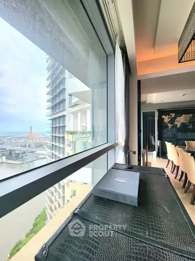 Luxurious high-rise apartment with stunning river view and elegant interior design.