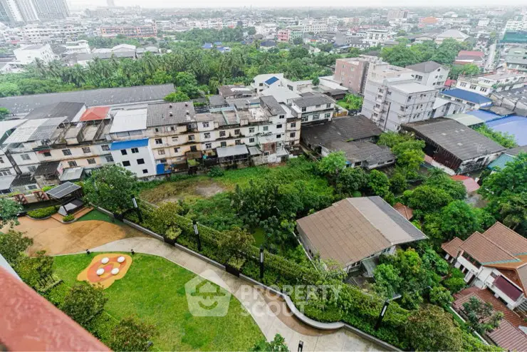 Stunning aerial view of urban landscape with lush greenery and residential buildings.