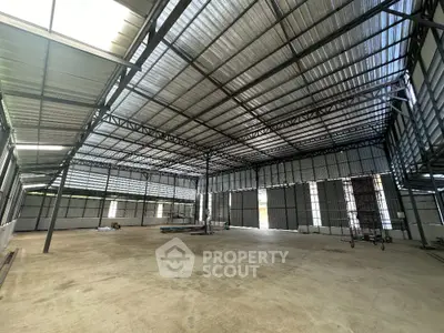 Spacious industrial warehouse with high ceilings and ample natural light