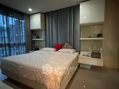 Cozy bedroom with modern decor and large window view