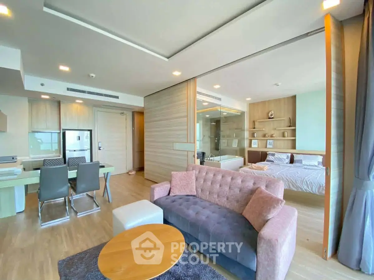 Spacious modern living room with open layout and stylish furniture in a luxury apartment.
