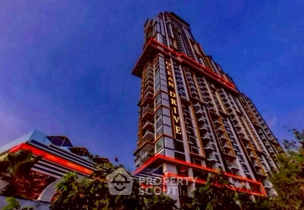 Stunning high-rise building with modern architecture and vibrant lighting against a twilight sky.