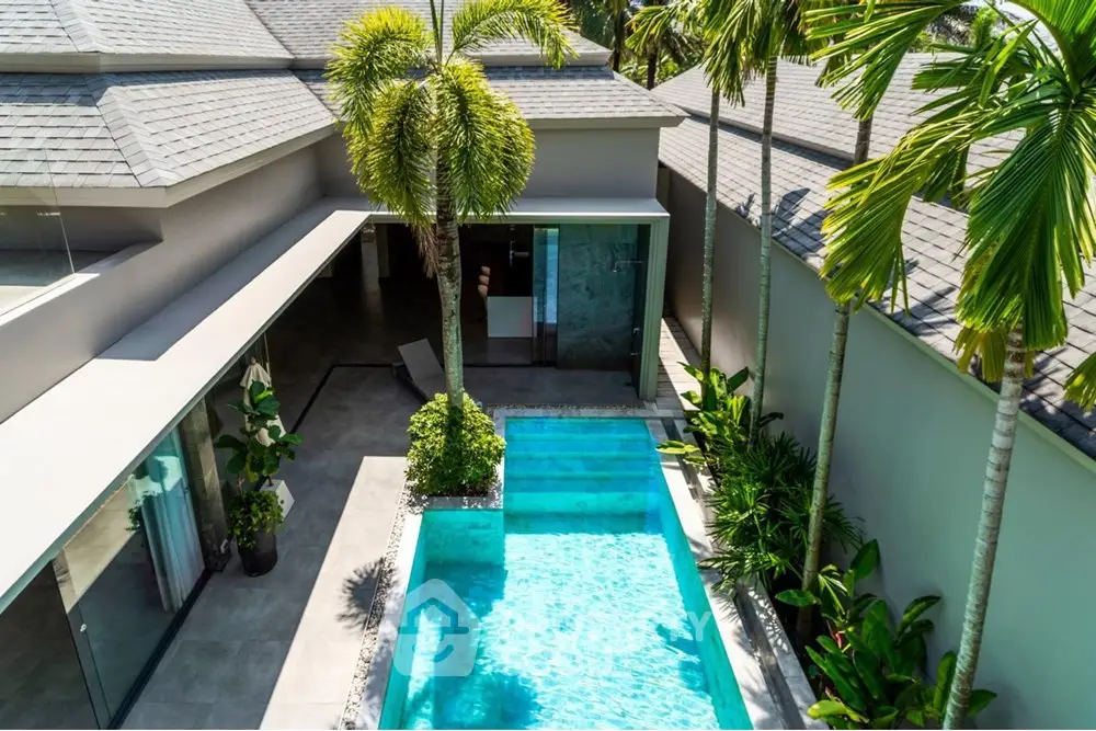 Luxurious modern villa with private pool and lush tropical garden