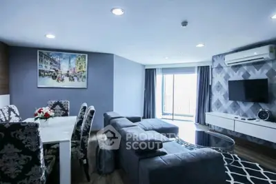 Spacious modern living room with stylish decor and large windows