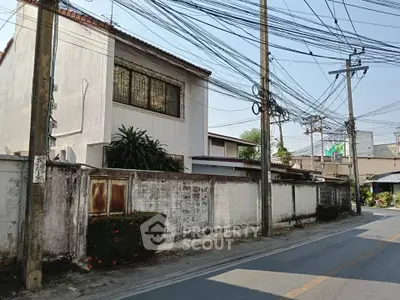 Charming suburban house with rustic exterior and lush greenery, perfect for family living.