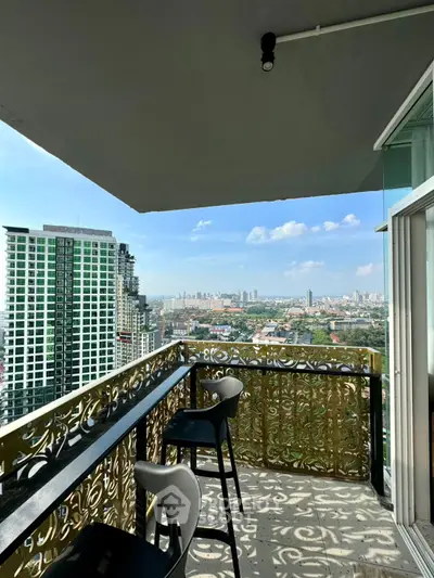 Stunning balcony with intricate railing offering panoramic city views