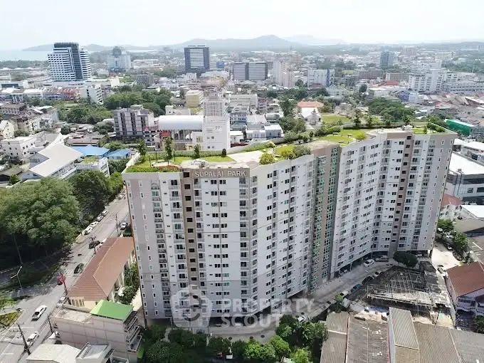 Stunning aerial view of Supalai Park condominium with lush rooftop garden in vibrant cityscape.