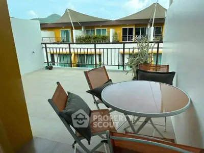 Spacious balcony with mountain view, perfect for outdoor relaxation and dining.