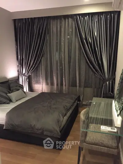 Cozy bedroom with elegant dark curtains and modern decor