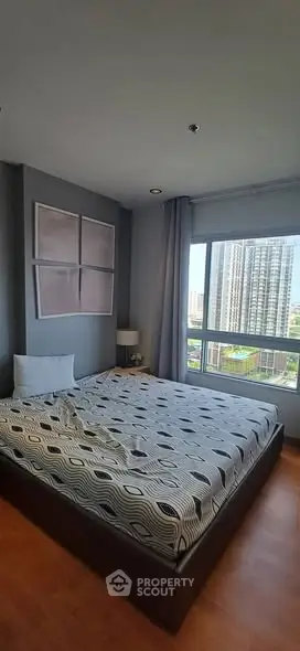 Modern bedroom with city view and stylish decor