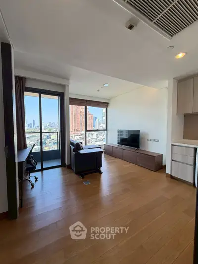 Modern living room with city view, wooden flooring, and sleek furniture in a high-rise apartment.