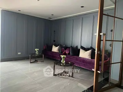 Elegant living room with modern purple sofa and stylish decor