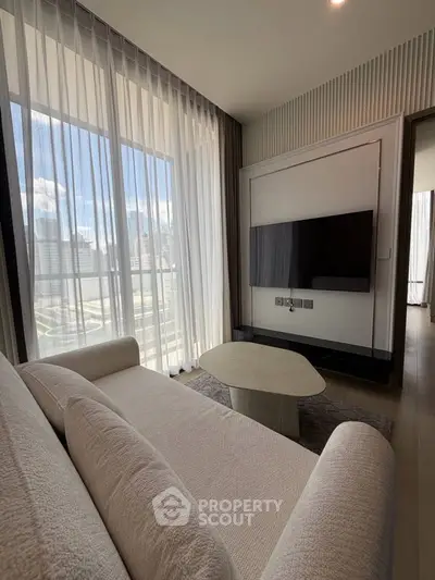Modern living room with floor-to-ceiling windows and city view