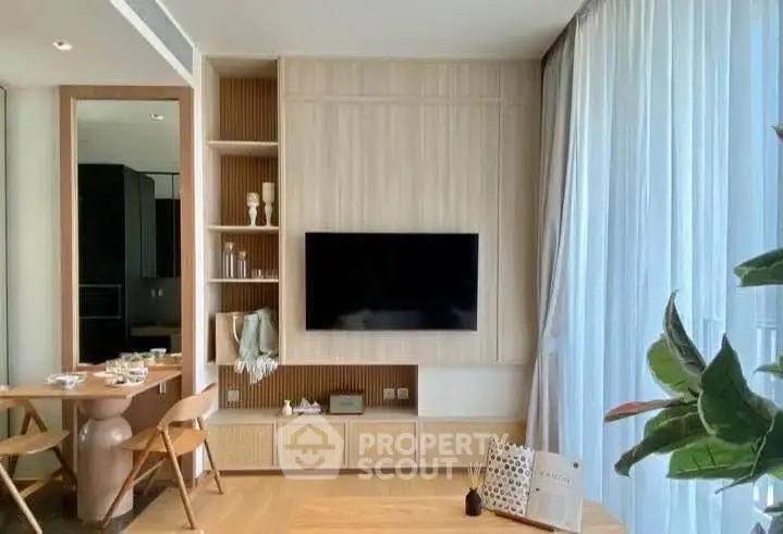 Modern living room with stylish decor and large window for natural light