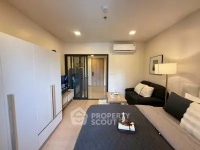 Modern bedroom with sleek design, featuring a cozy bed, stylish wardrobe, and elegant lighting.