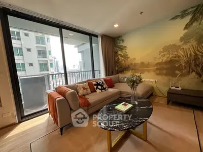 Stylish living room with large windows and balcony in modern apartment