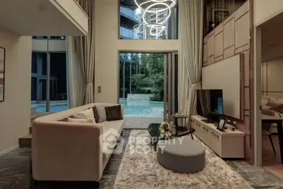 Luxurious living room with pool view, modern decor, and elegant lighting in a high-end apartment.