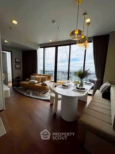 Luxurious living room with panoramic city view, modern decor, and elegant lighting.