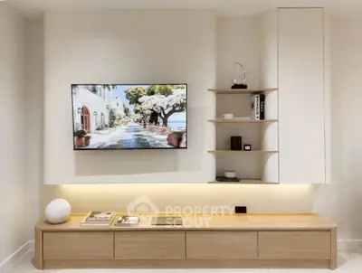 Modern living room with sleek TV setup and stylish shelving